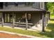 Covered porch features dining table and decor, providing a cozy outdoor space at 2469 River Oak Dr, Decatur, GA 30033