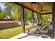 Covered outdoor patio features a dining table and view of the backyard at 2469 River Oak Dr, Decatur, GA 30033