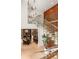 Open staircase with glass railings and views of the dining room and modern decor at 2469 River Oak Dr, Decatur, GA 30033