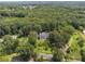 Picturesque aerial view of a home nestled among mature trees in a lush, green setting at 269 Red Gate Dr, Canton, GA 30115