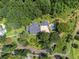 Expansive property with a home, pool, and verdant landscaping surrounded by mature trees at 269 Red Gate Dr, Canton, GA 30115