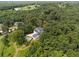 Expansive aerial view of a beautiful home surrounded by mature trees, offering privacy and seclusion at 269 Red Gate Dr, Canton, GA 30115