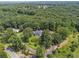 Sprawling property featuring a well-maintained home, lush landscaping, and a winding driveway, surrounded by mature trees at 269 Red Gate Dr, Canton, GA 30115