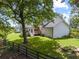 Spacious backyard featuring a firepit, wooden fence, steps leading to the house, and lush green lawn at 269 Red Gate Dr, Canton, GA 30115