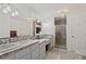 Bathroom with double sinks, stone counter tops, tiled shower, and neutral finishes at 269 Red Gate Dr, Canton, GA 30115