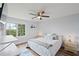 Bedroom featuring a queen bed, ceiling fan, and a window with scenic views at 269 Red Gate Dr, Canton, GA 30115