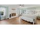 Spacious main bedroom featuring a fireplace, ceiling fan, and hardwood floors at 269 Red Gate Dr, Canton, GA 30115