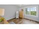 Bedroom with lots of light, light gray walls, wood floors, and scenic views at 269 Red Gate Dr, Canton, GA 30115
