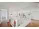 Second floor open bonus room, with hardwood floors, white posts, and lots of light at 269 Red Gate Dr, Canton, GA 30115