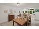 Bright dining room featuring wood table, chairs, and view to the Gathering room and kitchen at 269 Red Gate Dr, Canton, GA 30115