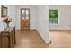 Inviting foyer with hardwood floors and decorative glass paneled front door at 269 Red Gate Dr, Canton, GA 30115
