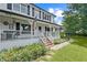 Charming two-story home with a inviting white-railed porch and beautifully landscaped front yard at 269 Red Gate Dr, Canton, GA 30115