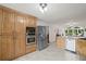 Kitchen with stainless steel appliances, cabinets, granite countertops and view to Gathering room at 269 Red Gate Dr, Canton, GA 30115