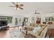 Open-concept living room with hardwood floors and comfortable seating area at 269 Red Gate Dr, Canton, GA 30115