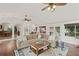 Open-concept living room with hardwood floors and comfortable seating area at 269 Red Gate Dr, Canton, GA 30115