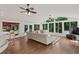 Open-concept living room featuring hardwood floors, neutral color palette, and bar at 269 Red Gate Dr, Canton, GA 30115