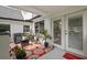 Charming covered patio with wicker furniture, bright rug, and sliding glass doors to let the sunshine in at 269 Red Gate Dr, Canton, GA 30115