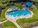 Inviting backyard with a stone-lined pool, hot tub, patio, and lush landscaping at 269 Red Gate Dr, Canton, GA 30115