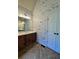 Bathroom featuring a double vanity, tile floor, and wood paneling at 71 Tobinleigh Ct, Acworth, GA 30101