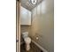 Bathroom featuring a toilet and built-in storage cabinet at 71 Tobinleigh Ct, Acworth, GA 30101