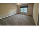 Bedroom featuring neutral paint and large window at 71 Tobinleigh Ct, Acworth, GA 30101