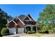 Charming two-story brick home with a well-manicured front yard, two-car garage, and inviting entrance at 71 Tobinleigh Ct, Acworth, GA 30101