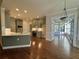 Charming kitchen features custom cabinets, sleek countertops, stainless appliances, and hardwood floors at 71 Tobinleigh Ct, Acworth, GA 30101
