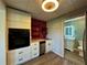 Stylish kitchenette features modern cabinets, an oven, a sink, and sleek stainless steel appliances near an adjacent bathroom at 71 Tobinleigh Ct, Acworth, GA 30101