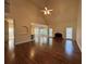 Spacious living room with high ceilings, hardwood floors, fireplace, and lots of natural light at 71 Tobinleigh Ct, Acworth, GA 30101