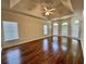 Main bedroom with tray ceiling, hardwood floors, and large windows at 71 Tobinleigh Ct, Acworth, GA 30101