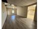 Spacious room with new flooring and a large window is ready to be finished with your creative touches at 71 Tobinleigh Ct, Acworth, GA 30101