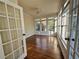 Sunroom with beautiful natural light, hardwood floors, and multiple windows at 71 Tobinleigh Ct, Acworth, GA 30101