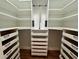 Spacious walk-in closet with custom shelves, drawers, and hanging rods at 71 Tobinleigh Ct, Acworth, GA 30101