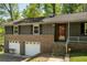 Charming two-story home featuring a brick facade and two-car garage at 3105 Sumac Dr, Atlanta, GA 30360