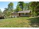 Beautiful two-story home with a spacious front yard, brick accents, and lush greenery at 3105 Sumac Dr, Atlanta, GA 30360