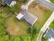 Aerial view of home highlighting large, fenced backyard with deck, mature trees, and driveway access at 244 Pauladean Se Cir, Marietta, GA 30067