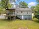 Backyard with a deck, stairs, and a covered patio at 244 Pauladean Se Cir, Marietta, GA 30067
