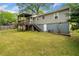 Expansive backyard featuring a wooden deck and well-maintained lawn, perfect for outdoor activities and relaxation at 244 Pauladean Se Cir, Marietta, GA 30067
