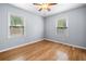 Bedroom featuring hardwood floors and two windows at 244 Pauladean Se Cir, Marietta, GA 30067