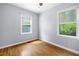 Bedroom featuring hardwood floors and natural light from two windows at 244 Pauladean Se Cir, Marietta, GA 30067