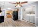 Kitchen featuring laminate floors, neutral paint, wood cabinets and black appliances at 244 Pauladean Se Cir, Marietta, GA 30067
