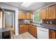 Cozy kitchen features tile backsplash, laminate floors, and ample cabinet space at 244 Pauladean Se Cir, Marietta, GA 30067