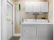 Laundry room with shelving, cabinet, washer and dryer at 244 Pauladean Se Cir, Marietta, GA 30067