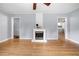 Light-filled living room boasts wood floors and a charming fireplace at 244 Pauladean Se Cir, Marietta, GA 30067
