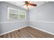 Room features wood flooring, wainscoting, and a ceiling fan at 244 Pauladean Se Cir, Marietta, GA 30067
