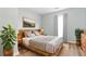 Neutral bedroom featuring a wooden bed frame, hardwood floors, and a rustic dresser at 3917 Dallas Acworth Nw Hwy, Acworth, GA 30101