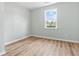 Bright bedroom featuring hardwood floors and a large window with natural light at 3917 Dallas Acworth Nw Hwy, Acworth, GA 30101