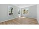 Sunlit bedroom featuring hardwood floors and large windows at 3917 Dallas Acworth Nw Hwy, Acworth, GA 30101