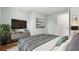 Well lit bedroom with a mounted TV, hardwood floors, and modern decor at 3917 Dallas Acworth Nw Hwy, Acworth, GA 30101