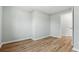 Spacious bedroom with hardwood floors, light-colored walls, and a doorway leading to another room at 3917 Dallas Acworth Nw Hwy, Acworth, GA 30101